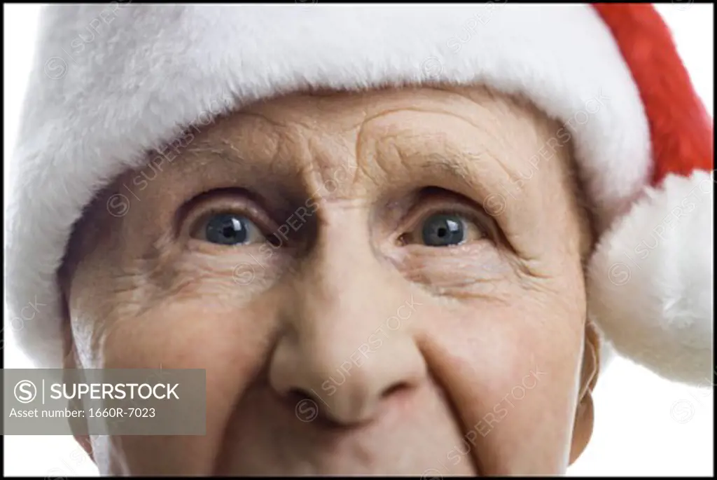 Portrait of a senior man wearing a Santa hat