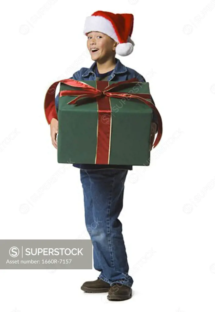 Portrait of a boy holding a Christmas present
