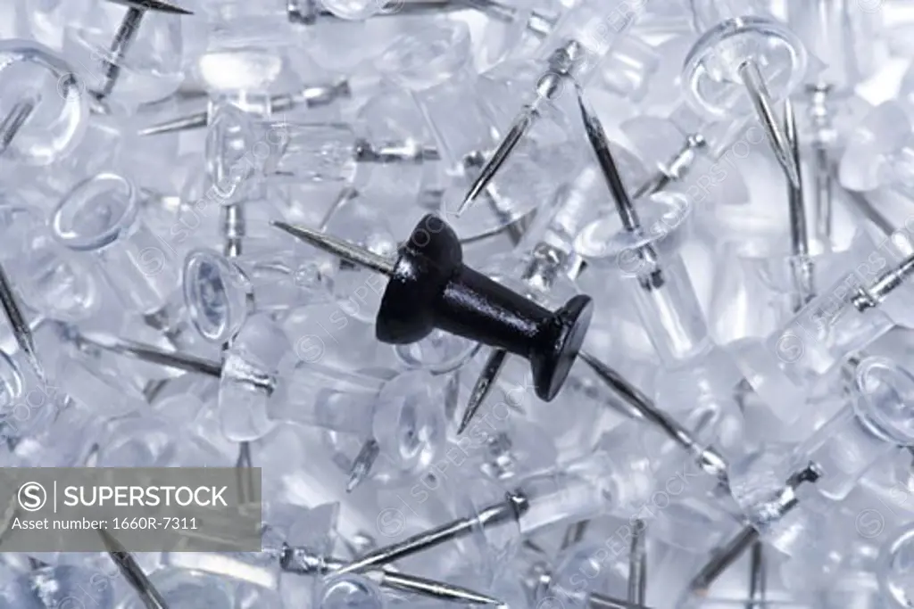 Close-up of a pile of thumbtacks