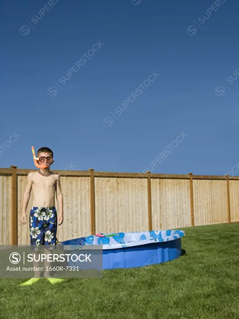 Portrait of a boy wearing flippers and snorkel