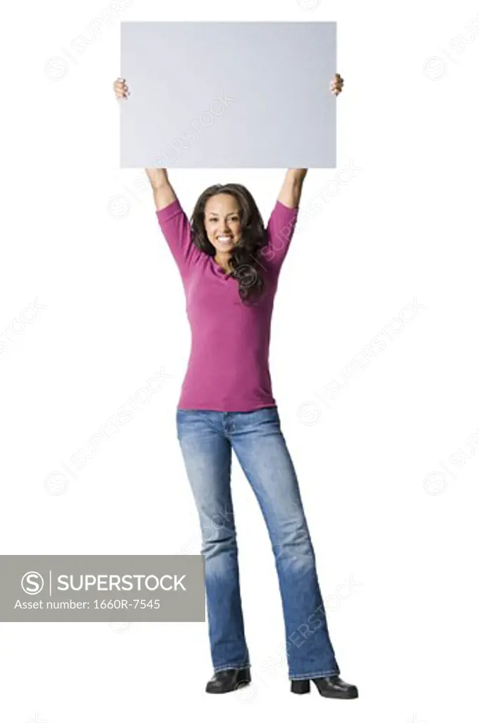 Portrait of a young woman holding a blank sign