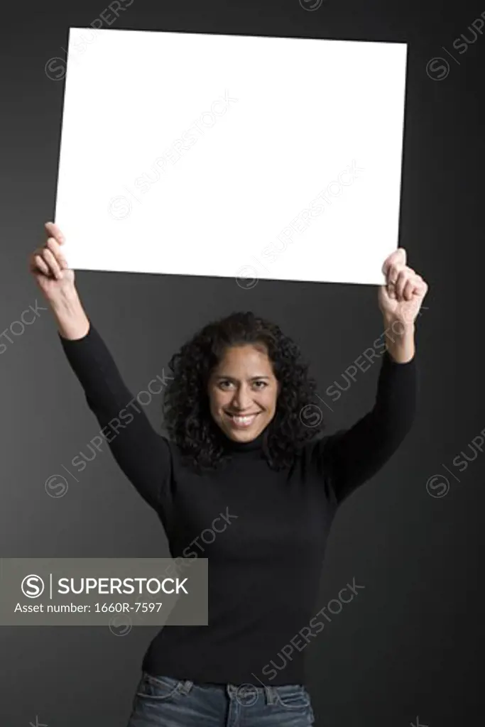 Portrait of a woman holding a blank sign