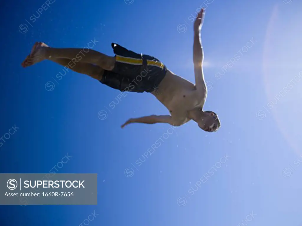 Low angle view of a man diving