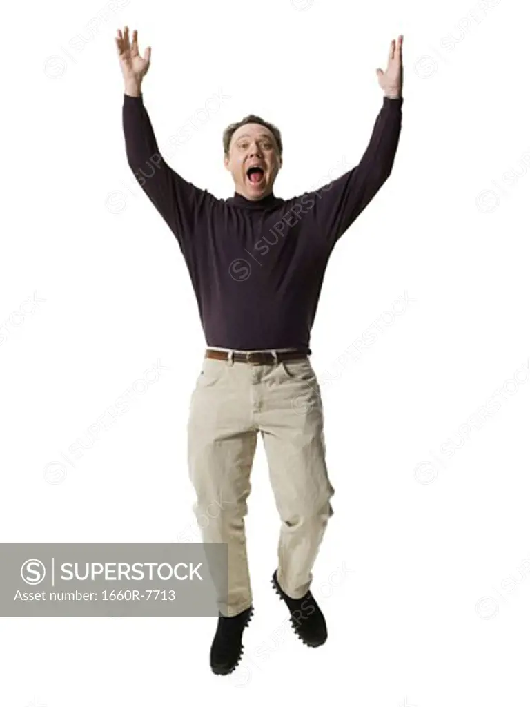 Portrait of a mature man jumping
