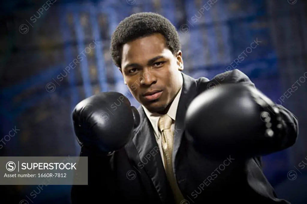 Portrait of a businessman boxing