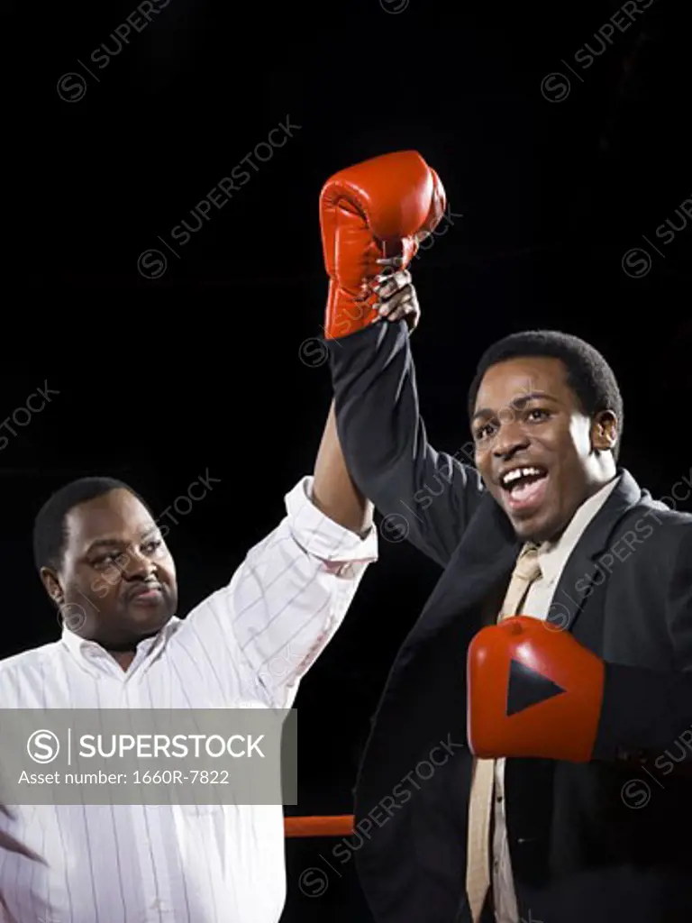Referee declaring the winner of a boxing match