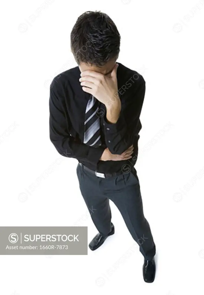 High angle view of a businessman looking depressed
