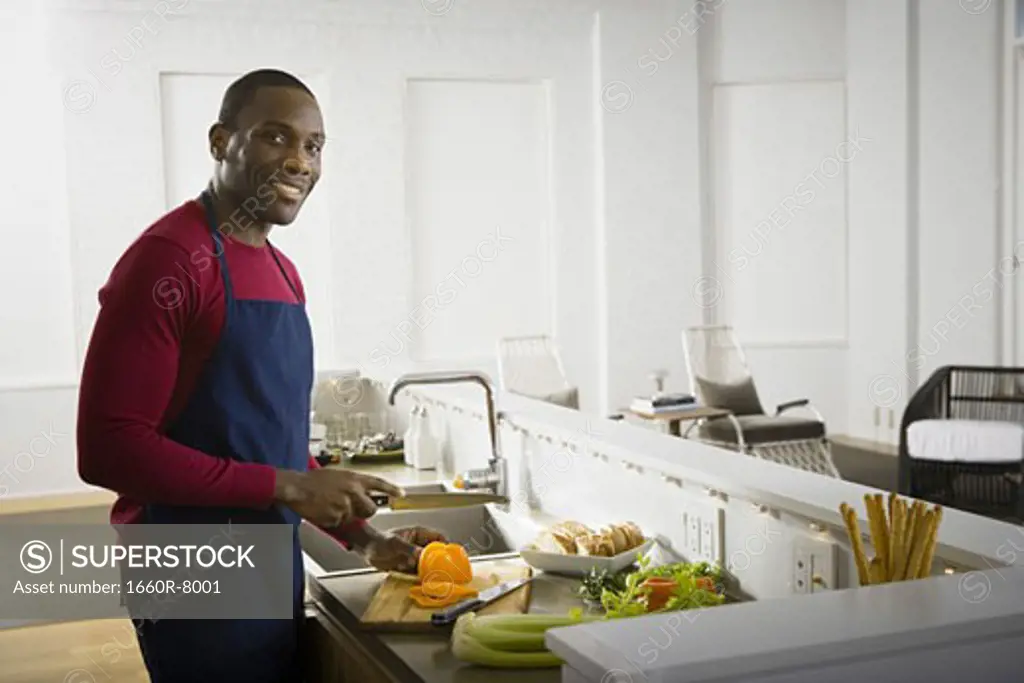 Portrait of a man preparing a meal