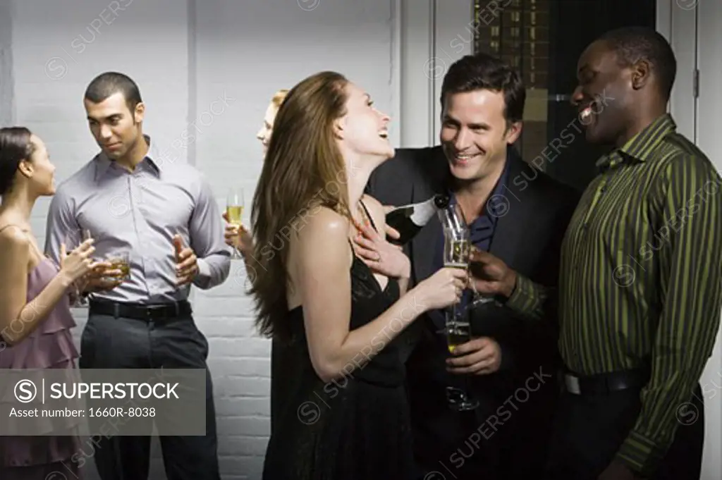 Group of people talking at a party