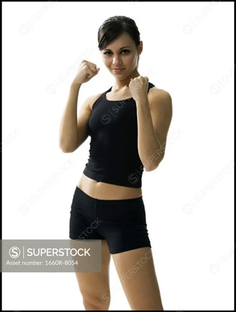 Portrait of a woman making fists