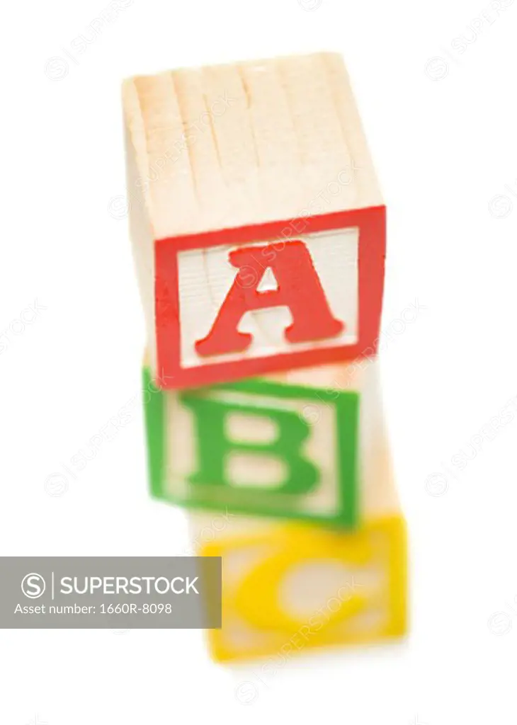 High angle view of a stack of alphabet blocks