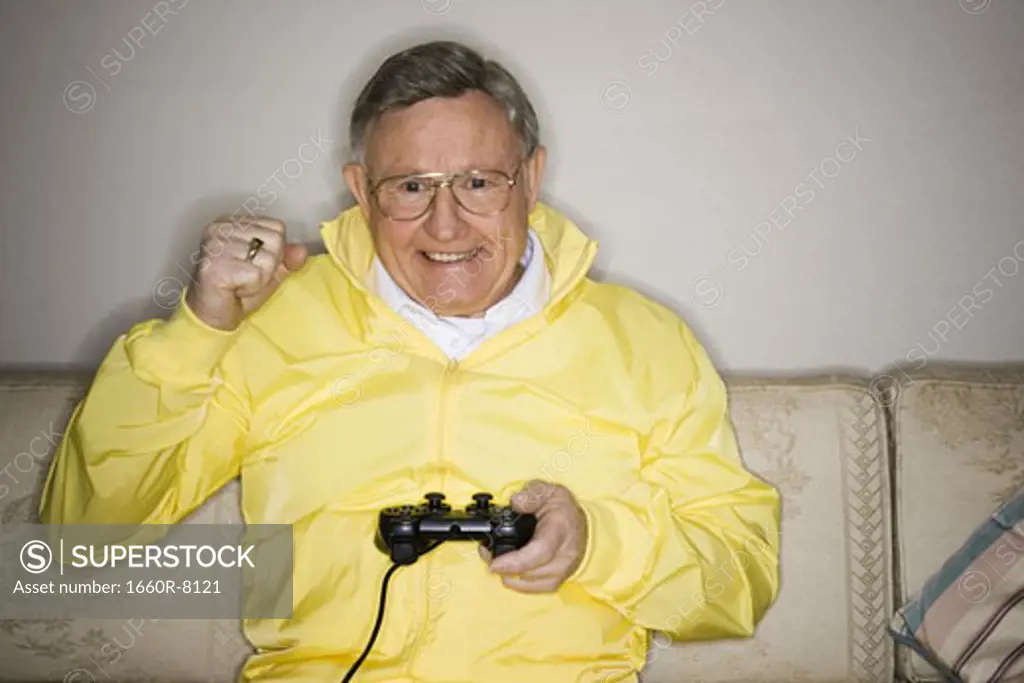 Close-up of a senior man playing a video game
