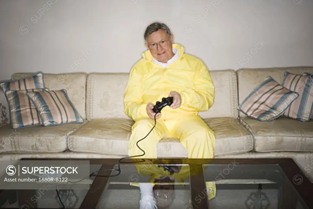 Senior man playing a video game