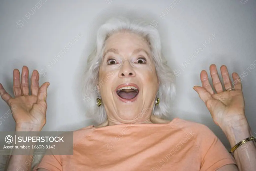 Portrait of a senior woman looking surprised