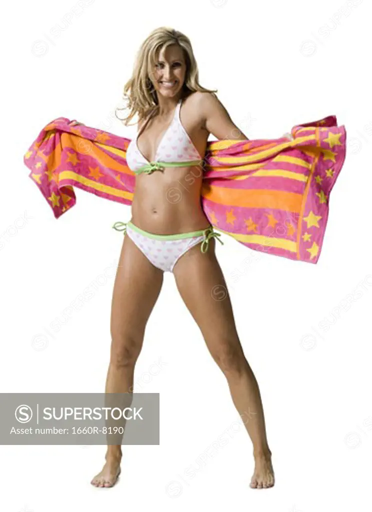 Portrait of a woman in a bikini with a towel