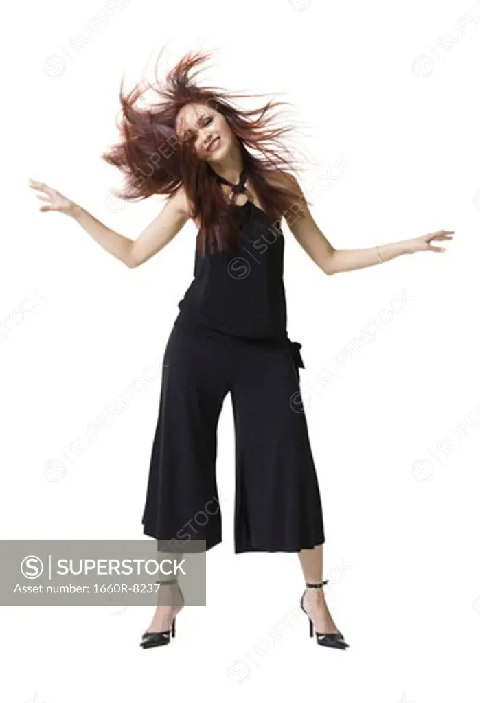 Young woman tossing her hair