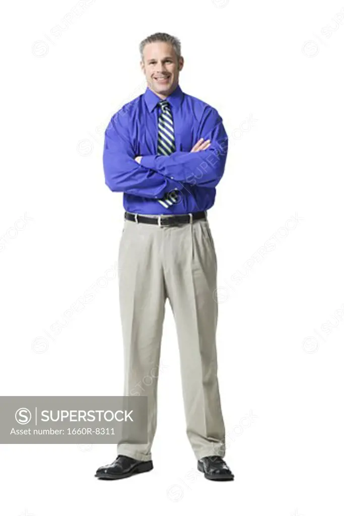 Portrait of a businessman standing with his arms folded