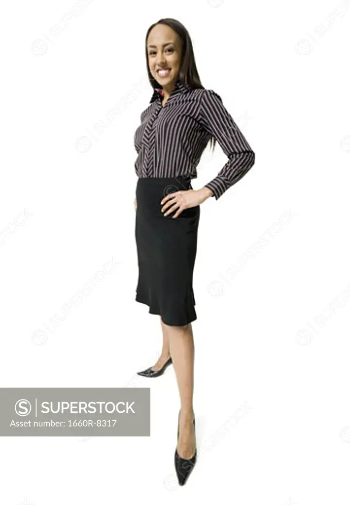 Portrait of a businesswoman standing with hands on hips