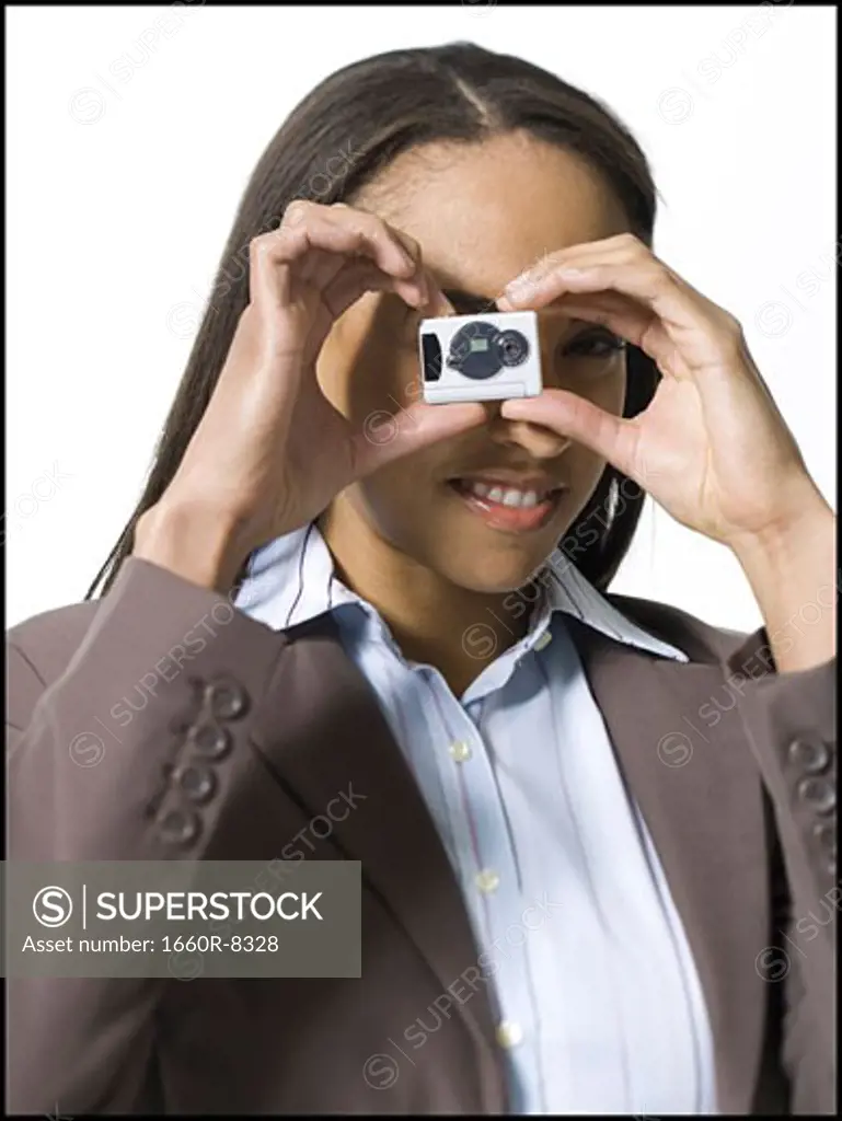 Portrait of a businesswoman using a digital camera