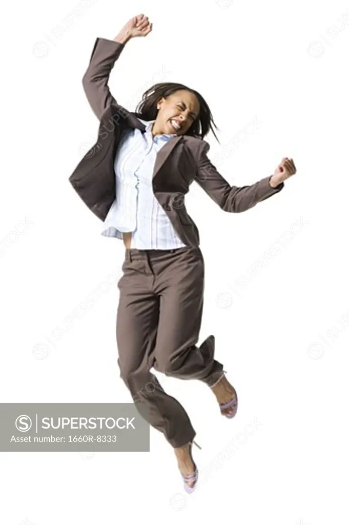 Businesswoman jumping in mid-air