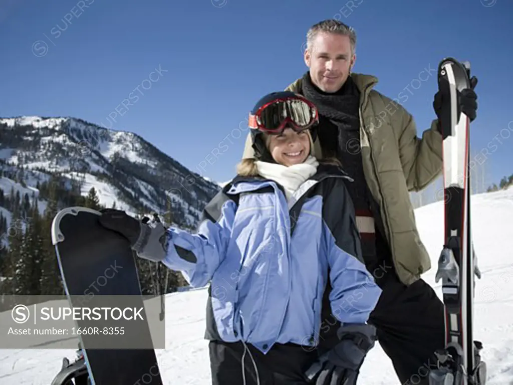 Portrait of a father and his daughter smiling