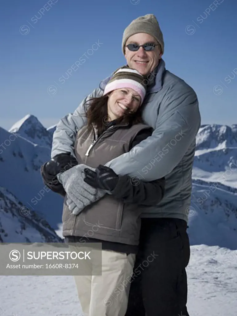 Portrait of a mature man embracing a mature woman from behind