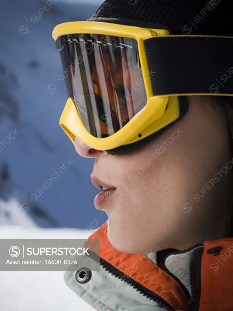 Profile of an adult woman wearing ski goggles