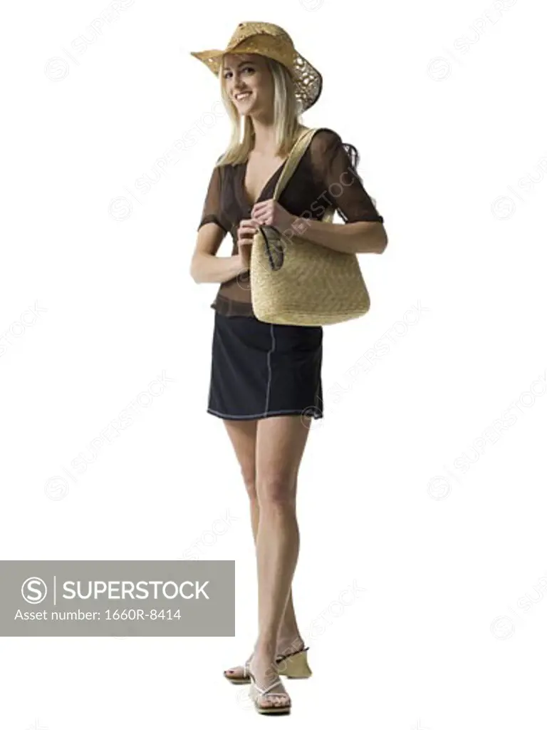 Portrait of a young woman carrying a hand bag