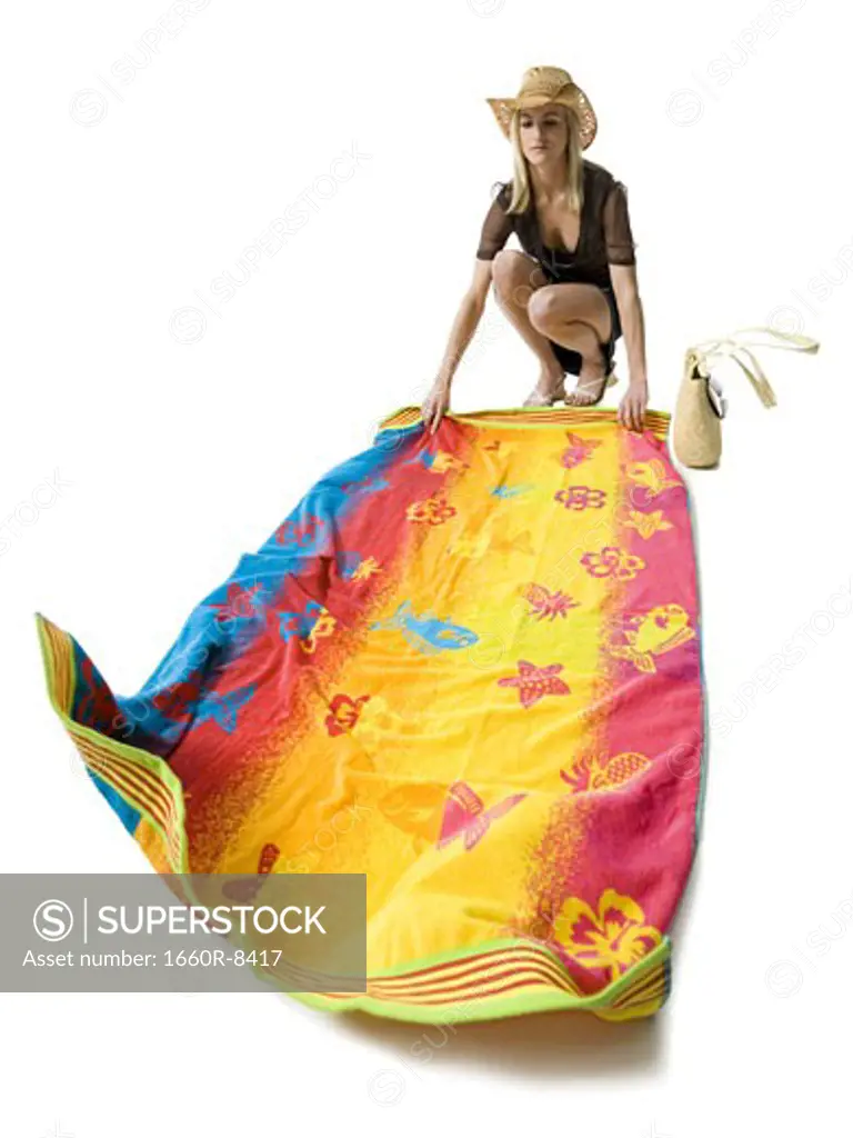 Young woman holding a beach towel