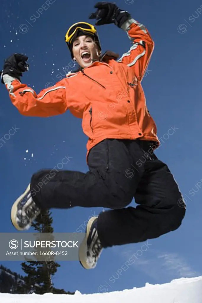 Low angle view of an adult woman jumping