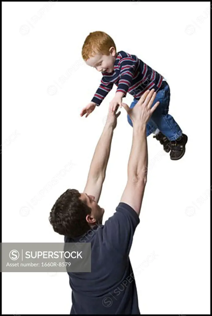 Profile of a father catching his son