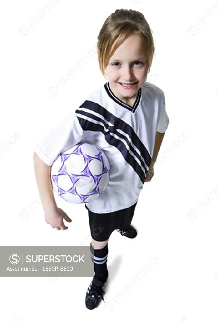 High angle view of a girl holding a soccer ball