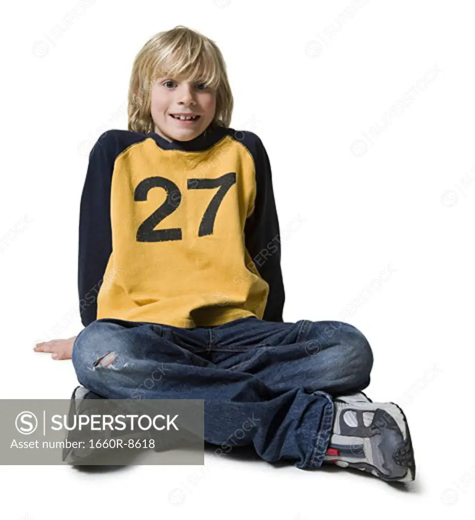 Portrait of a boy sitting on the floor