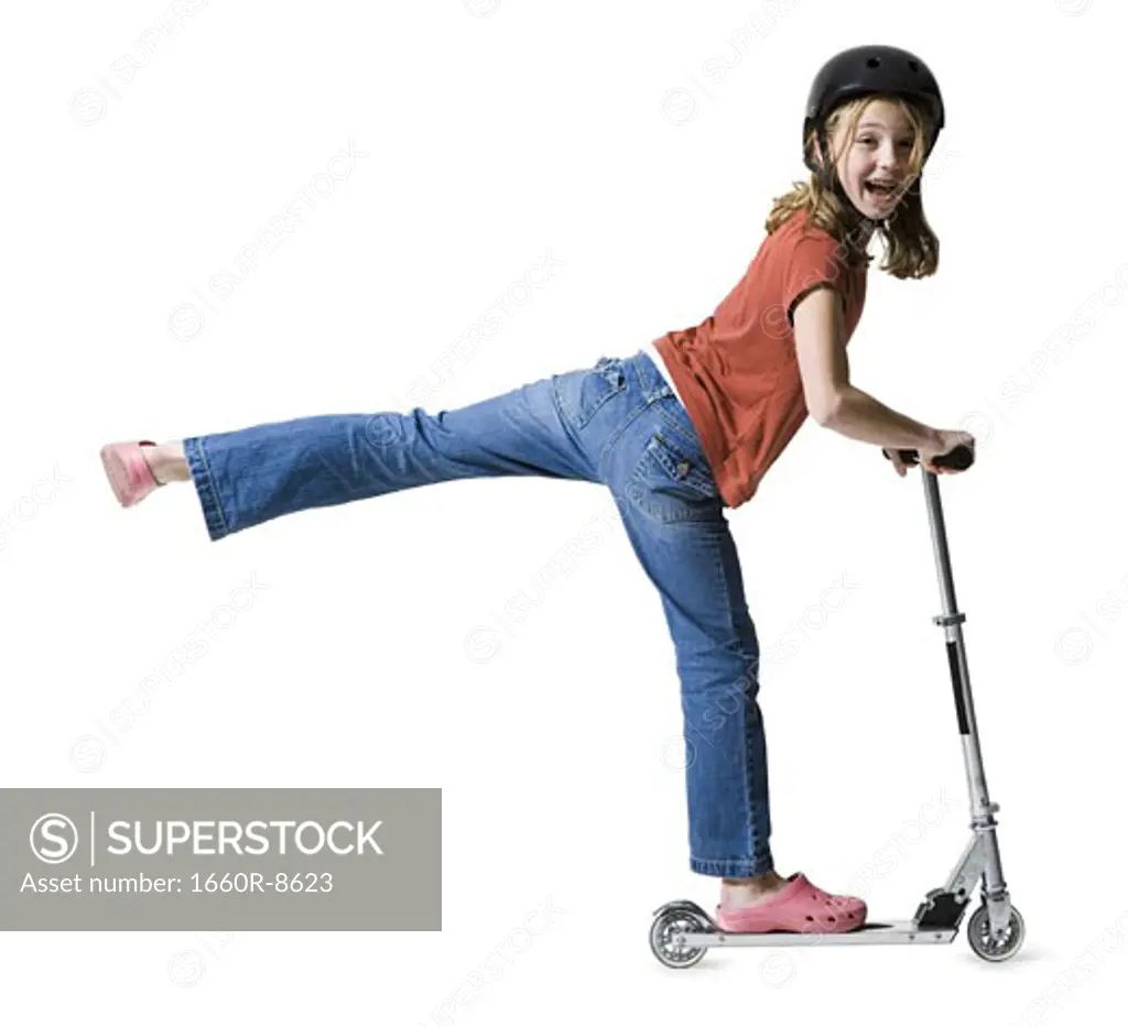 Portrait of a girl riding on a scooter