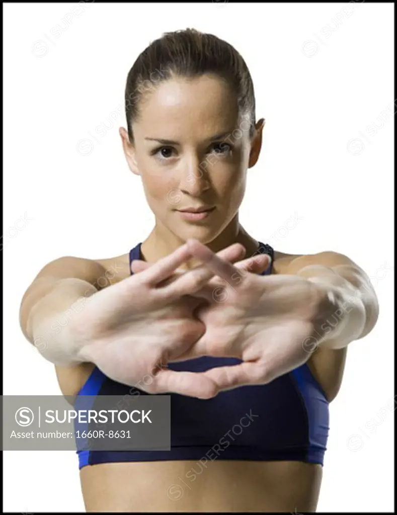 Portrait of a woman stretching her arms
