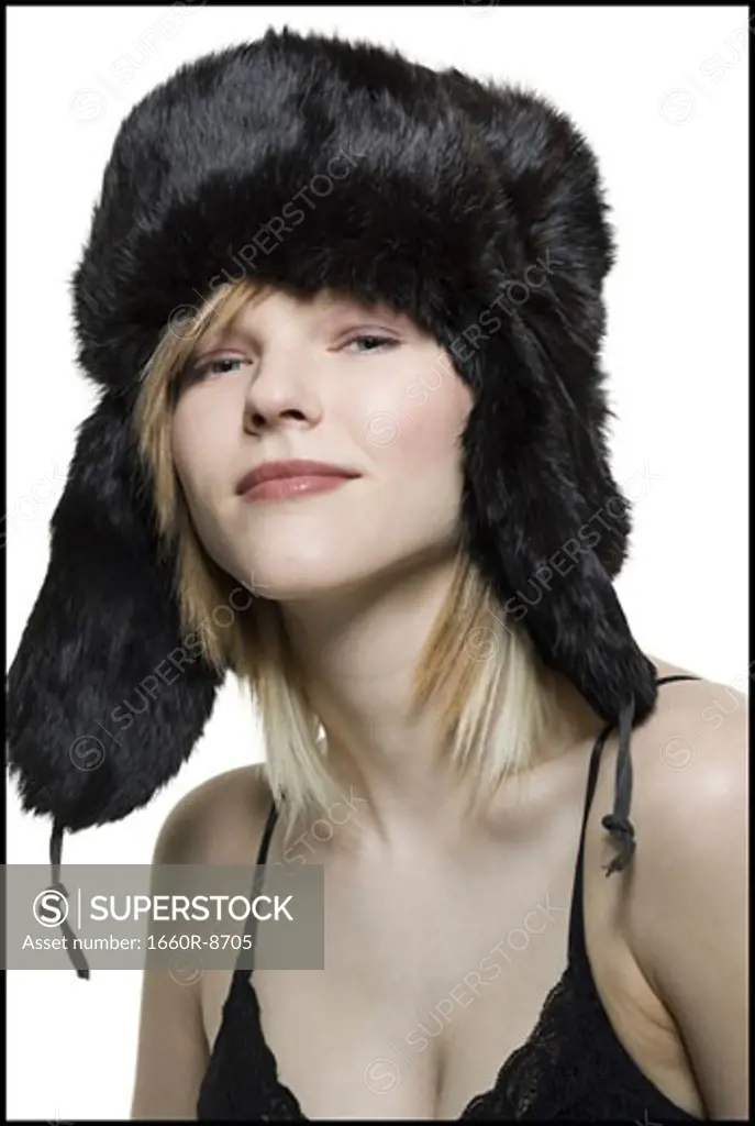 Portrait of a young woman wearing a fur hat
