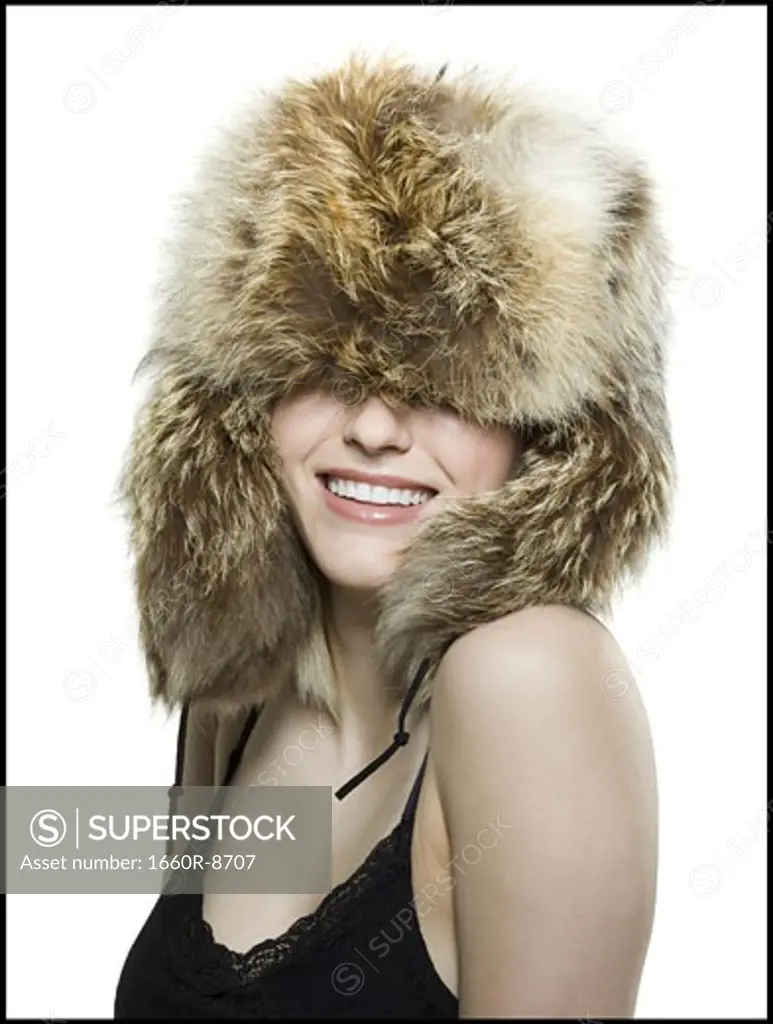 Close-up of a young woman wearing a fur hat