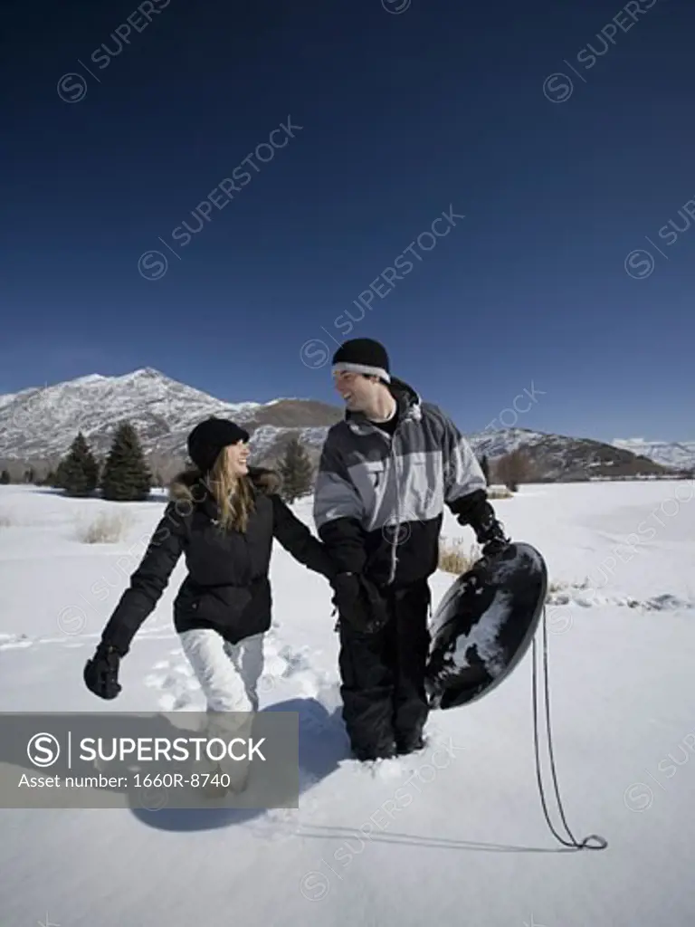 Young couple walking in snow