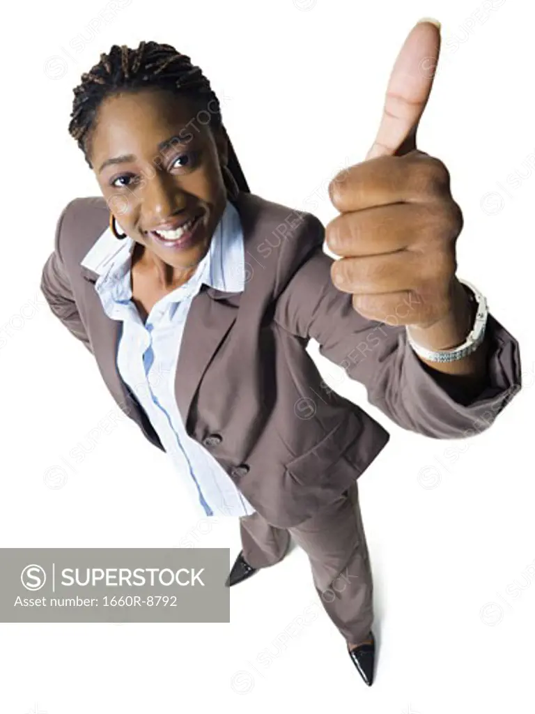 High angle view of a businesswoman showing a thumbs up sign