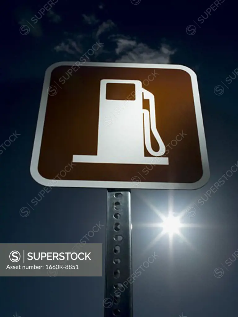 Low angle view of a gas station road sign