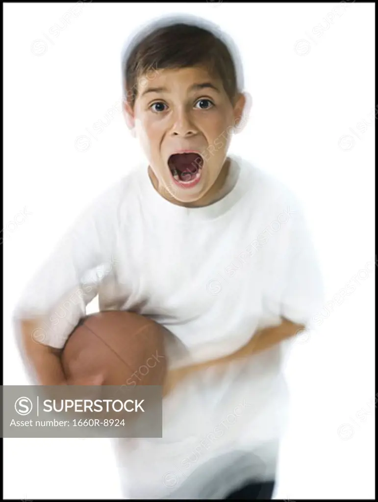 Portrait of a boy holding a football
