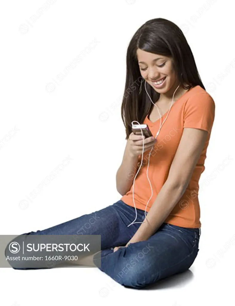 Girl looking at an MP3 player