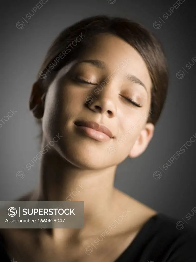 Close-up of a girl with her eyes closed