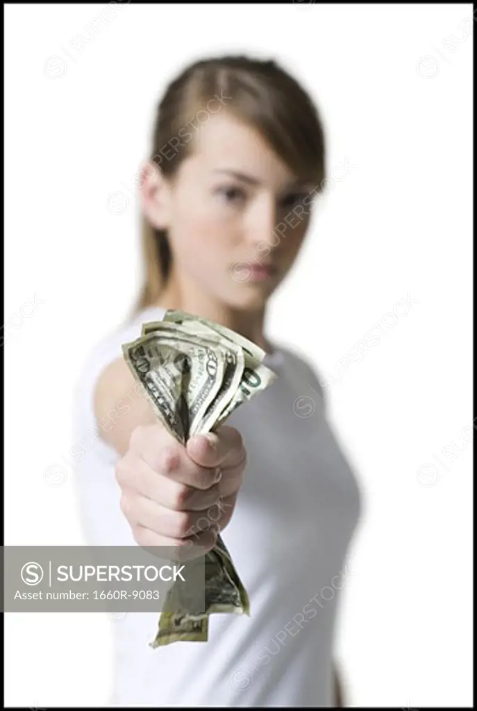 Portrait of a girl holding American dollar bills