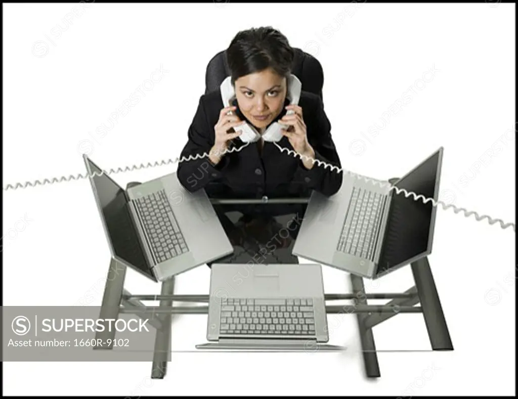 High angle view of a businesswoman multi-tasking