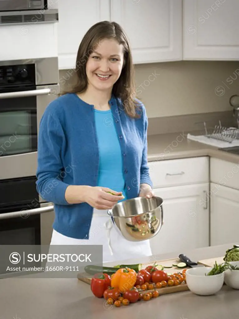 Portrait of a mid adult woman standing in the kitchen
