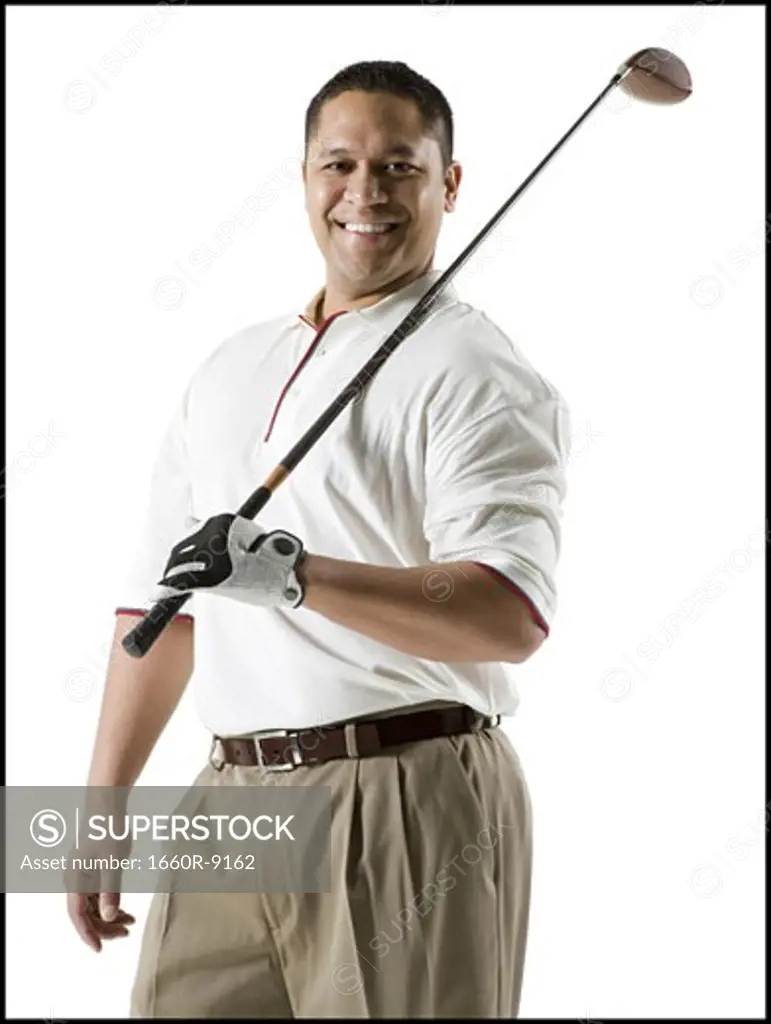 Portrait of a mid adult man holding a golf club