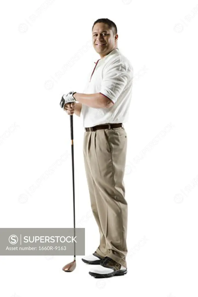Profile of a mid adult man holding a golf club