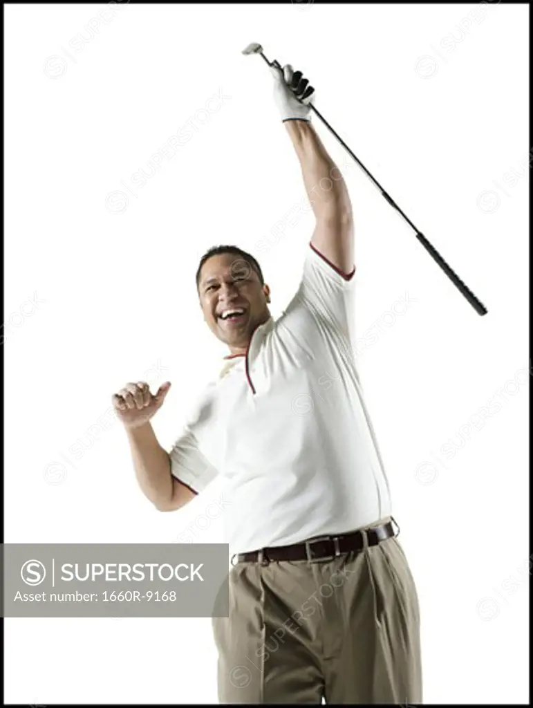 Low angle view of a mid adult man holding a golf club