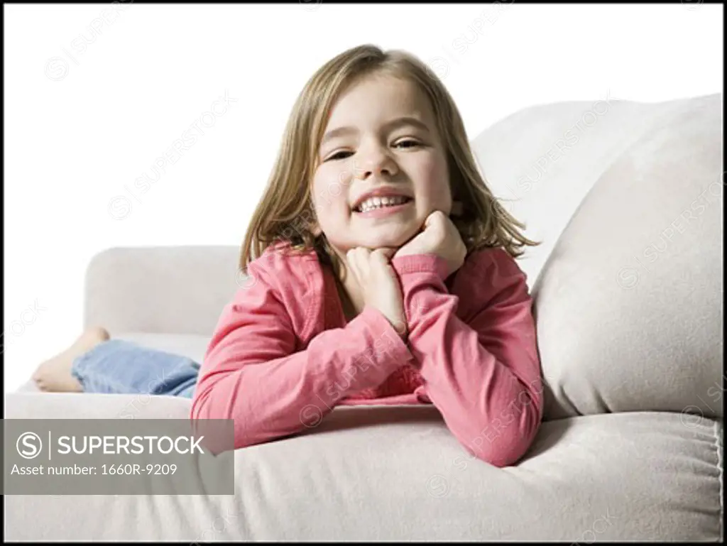 Portrait of a girl lying on a couch